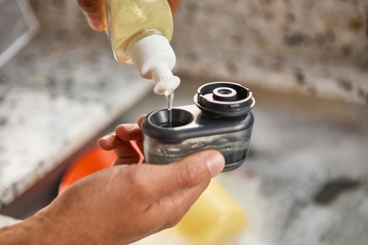 Joseph Joseph SinkTech Soap-Dispensing Palm Brush with Stainless-Steel Stand