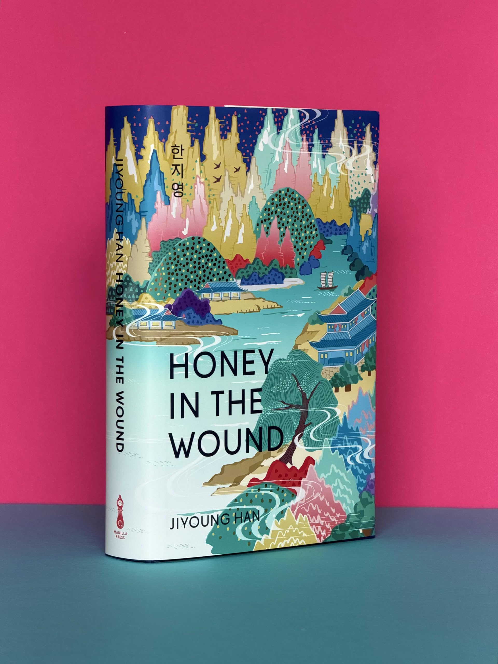 MANILLA PRESS Honey in the Wound - Magical Realism Family Saga | Hardcover